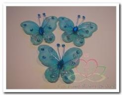 Vlinder Turq Blauw met diamantjes 5 cm. Bruidsdeco Vlinder Turq Blauw