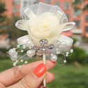 Luxe Bruidegomcorsage Ivory satijnroos met broche en parels kant en klaar